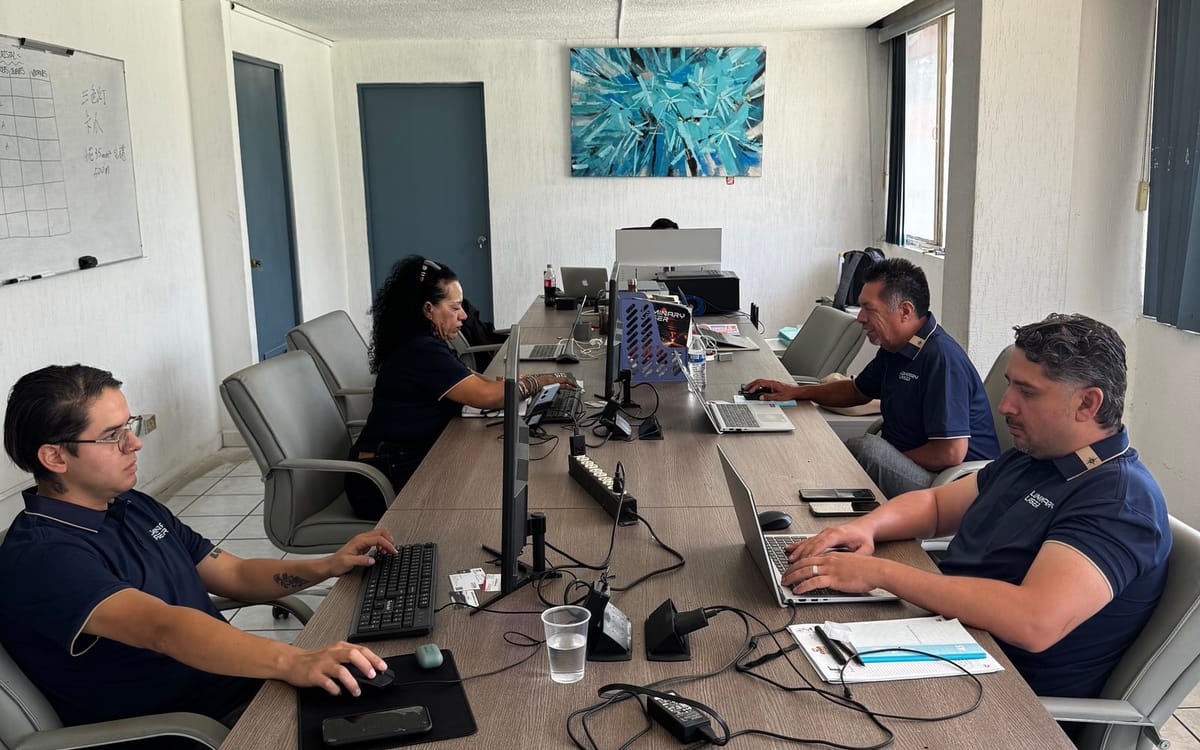 LUMINARY LASER sales and service team reviewing machine requirements