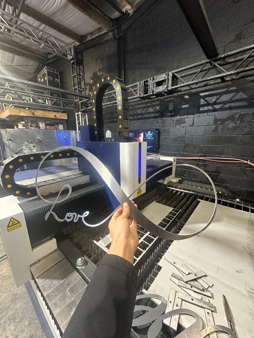 Fiber laser cutting machine in a metal fabrication production setting